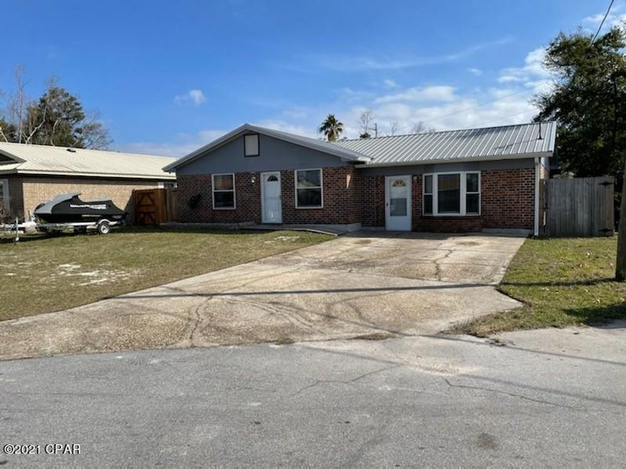 *Additional Pictures coming Saturday 1/16/21* Large 3 bedroom 2 bath home in great central location of St. Andrews.  This home had very little damage from Hurricane Michael, and it has been repaired.  Home has had some nice updates, including appliances, flooring, lighting and more.

The garage was converted to a large great room  so the old living room is now a wonderfully large dining or multi use area.  The bedrooms are nicely sized and the master has a private bath with the other two bathrooms sharing the second bath.  A nice storage building/workshop with electrical is included in the purchase!  Make your appointment to see this one today!