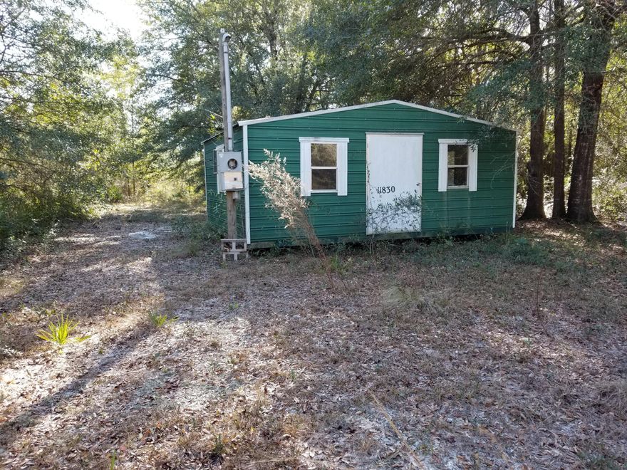 Amazing affordable lot, 3 blocks from Hwy 231.  There is a 20' x 16' Building on the lot, ready for you to add utilities for a weekend home or more.  Lot is mostly cleared already making it easy to finish as a home place. Nice hardwood trees on lot, Live Oaks, Magnolia, etc. Sellers paid $10,000 for the building, so sacrificing selling the lot and the building well below value!  Close to Hwy 20, fast drive to Interstate 10 and only 20 miles from Panama City and 35 miles to Panama City Beach.  Owner Financing available with minimum of $4000 down payment.