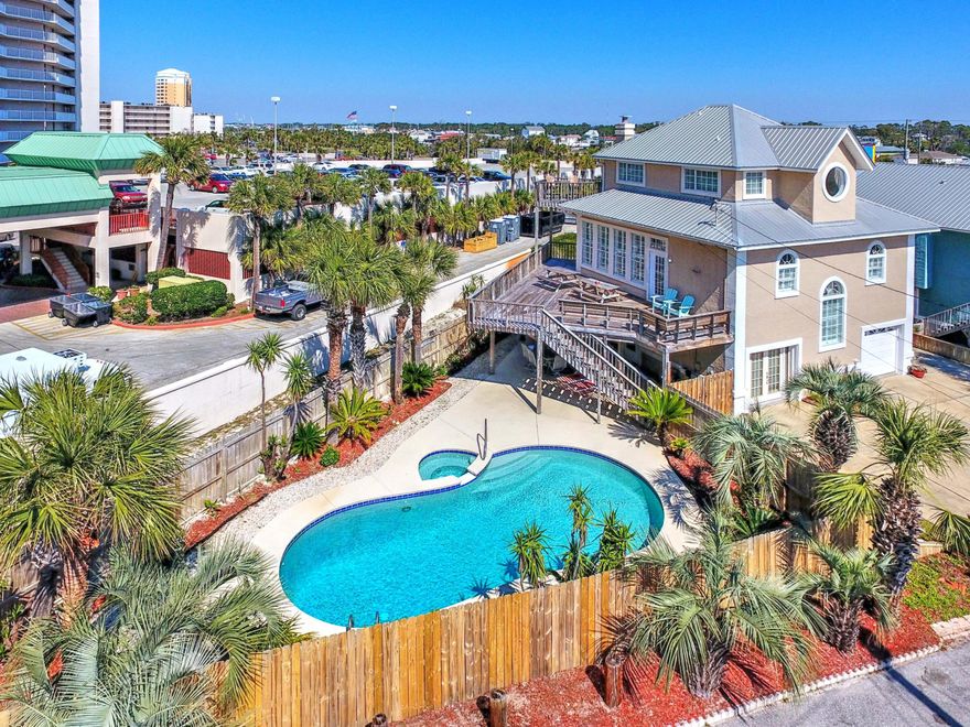 CURRENTLY UNDER CONTRACT, SELLER ACCEPTING BACKUP OFFERS. Gulf Views and awesome rental potential! Only steps to the beach!  Enjoy this neighborhood's deeded beach access.  Featuring 4 bedrooms, 3 full baths, bunk room, and a ''resort like'' backyard complete with pool and hot tub.  Relax and sunbathe or grill out on your spacious decks on both the 2nd and 3rd floors.  This beach home even has a garage! Recently painted, new hardwood floors, plantation shutters and rental ready for you just in time for the summer season!  Holiday Beach on the Gulf is a small community located South of Thomas Drive with private beach access and close to all Panama City Beach has to offer. Easy access to St Andrews State Park, restaurants, shopping and more.