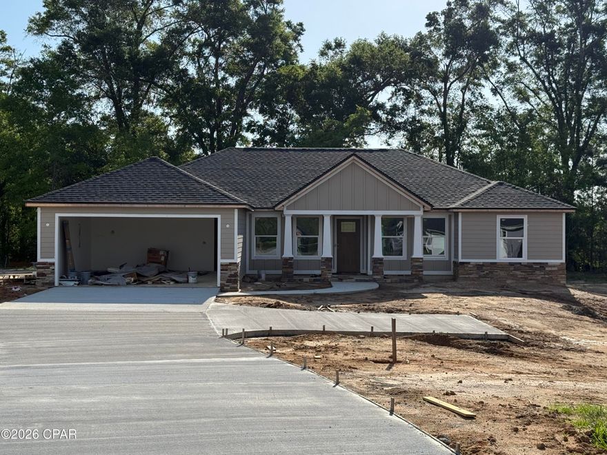 Brand New Construction, 1832 Sq Ft., 4 Bedroom 2 Bath, Split Floor Plan in the tranquil neighborhood of Cypress Tree Subdivision. Featuring an Open Concept Family and Kitchen Area, a Formal Dining Room and a Drop Zone inside off a two car Garage. Construction features include a 25 Year Architectural Style Shingle, Fiber Cement Siding, R 38 Insulation in the Attic to keep those power bills down and a Two Car Garage. Finishes include Hard Wood Cabinets throughout with Granite Countertops, New Appliances, Extensive Molding throughout, Upgraded Vinyl Plank and an upgraded Lighting Package. Master Bedroom includes a Tray Ceiling and Master Bath with a Tiled Walk-in Shower, Double Vanity and a Walk-In Closet. Completing the look outside, the house comes with a Landscape Package, a Full Front Porch and a back Covered Patio, perfect to sit and enjoy the sunset and the peaceful outdoors.  Convenient to downtown shopping, doctors offices and the many amenities Marianna has to offer. Example photos included are of an 1832 Model in a similar neighborhood, finishes will be comparable but may vary.  Estimated completion date is Mid March, 2026.  Make an appointment today to see all this property has to offer.