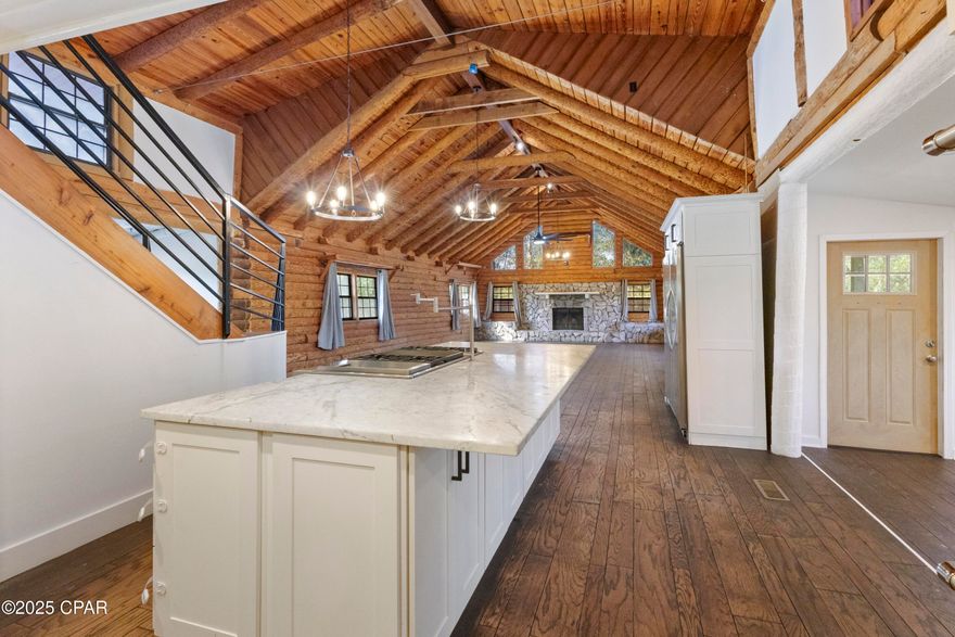 Looking for a beautifully crafted log cabin? 
You need to check this one out!  Set on 4.65 acres, this property is surrounded by mature trees and open space to provide perfect blend of privacy and peaceful living. 
Your breath will be taken away when you step inside! The spacious living room features soaring high ceilings, exposed wood beams and a beautiful wood burning fireplace. 
The newly renovated kitchen boasts contemporary finishes and offers plenty of space for cooking and entertaining. 
This home includes three bedrooms 2 1/2 bathrooms. A loft on the second floor provides perfect space for an office, Game room, or even an additional sleeping area.
There is a large detached RV/Boat garage for all your recreational vehicles, equipment, workshop needs.
All information deemed accurate but should be verified by buyer. Open House Sunday January 11th 1:30-4 pm