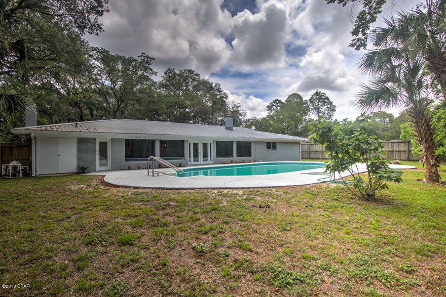 'CURRENTLY UNDER CONTRACT, SELLER ACCEPTING BACKUP OFFERS'This move in ready home is in need of a family. The remodeling has already been done. This brick home has a new roof, new water heater, Stainless appliances, Quartz counter tops in the kitchen and bathrooms. wood burning fireplace, new privacy fence, gutters,luxury vinyl flooring along with brick flooring. There are two living room areas and a Florida room overlooking the heated inground pool. You are surrounded by big oak trees and with the large lot you have plenty of space between your neighbors. Come and view this lovely home today.