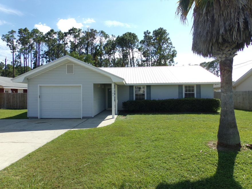 Brand New Metal Roof on this nice 3-Bedroom, 2-Bath home.  Centrally located close to the beach, Navy Base, St. Andrews State Park, and shopping/grocery.  All the flooring throughout the house is less than 3-years old. THE INTERIOR HAS JUST BEEN REPAINTED.   The AIR CONDITIONER IS LESS THAN 2-YEARS OLD.  THE LIFT STATION IS 1-YEAR OLD AND THE METAL ROOF IS LESS THAN 2-YEARS OLD. The exterior of this house is virtually maintenance free with metal roof, and vinyl siding, soffits, and facia.  This home has an open floor plan in the main living area with raised ceilings.  An oversized yard gives you plenty of space for a backyard pool and extensive landscaping.  This North Lagoon Dr. is close to the Navy Base and convenient to both Publix and Winn Dixie grocery stores, the fishing and dive fleets and marinas on Grand Lagoon, St. Andrews State Park, and area beaches.  This is a perfect house for a new family or retired couple.  This home was constructed by Clements Construction, a well known respected builder in the area for many years.  Come make this house your home.
