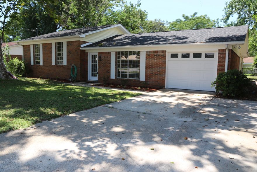 This is a large home at 1777 sq. ft. that has been completely remodeled.  New roof, new HVAC, new bathroom vanities, new shower and tub, new paint and carpet, etc. The home has a formal den with hardwood flooring and a family room too. There is also a separate room for your office or workshop depending on your needs in addition to the 3 bedroooms. The foyer, kitchen and bathrooms have travertine flooring. The home is mostly brick siding and has a large covered porch for relaxing in the back.  The back yard is also fenced.  Great location close to everything!!!.