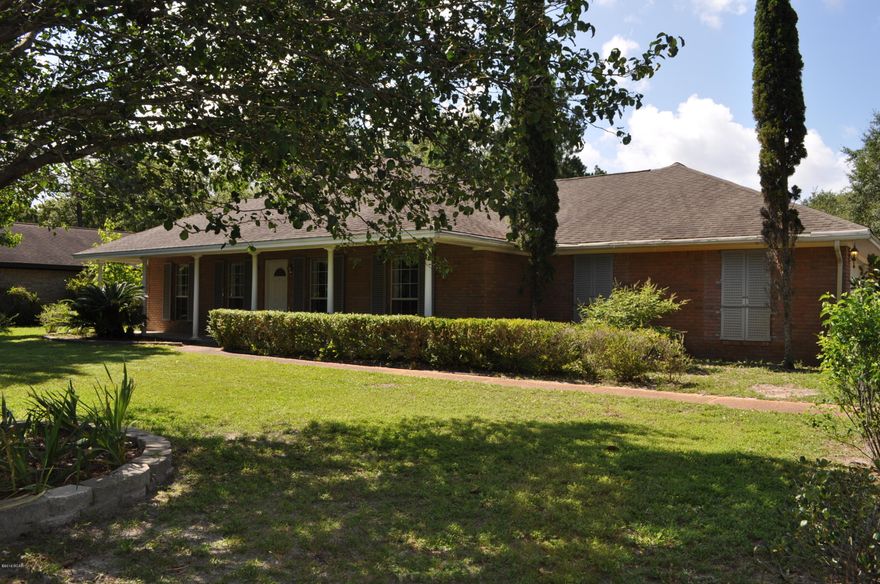 Well-maintained and move-in ready Lynn Haven home now available!  This 3BR/2BA stunner is situated on a 3/4 of an acre lot and offers 2,847 sqft of living space.  The home features a split-bedroom floor plan and lots of upgrades, including a new roof in 2014.  The kitchen boasts Corian countertops, a roomy breakfast nook, and a Dutch door connection to the Formal Dining Room which also has stained glass French doors to the living room.  The enormous glass atrium has two mini-splits allowing for the extra square footage; it's a great place for a party thanks to the large wet bar.  The backyard is filled with all sorts of fruit trees and vines including plums, oranges and grapes, to name a few.  There is also a large workshop/garage in addition to the attached oversized garage.  Additional features include a whole house generator, gale force hurricane shutters, new carpet in two of the bedrooms, and is NOT located in a flood zone.  This is a very quiet residential neighborhood close to schools, shopping, dining establishments and more.  All info is approx. and must be verified by Buyers if important.