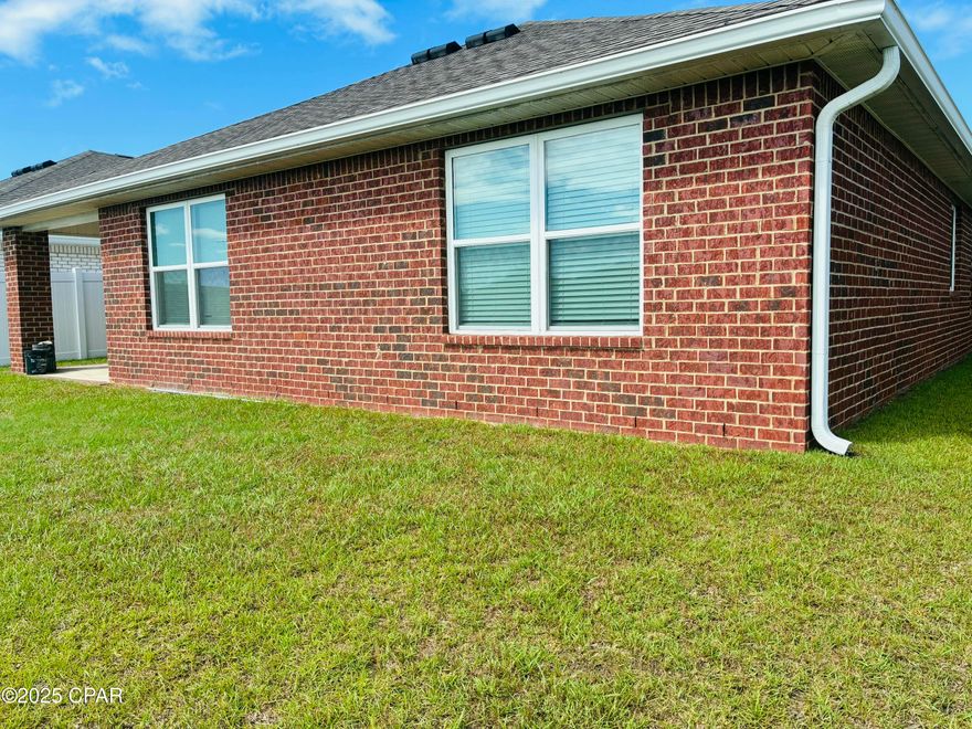 Welcome to Liberty - Panama City's Premier Lifestyle Community!
Nestled off Star Avenue near Hwy 231, Liberty offers easy access to Tyndall Air Force Base (25 min), local hospitals (20 min), and top shopping and dining (under 15 min).

Enjoy resort-style living with a 7,500 sq. ft. community center featuring a full gym, wellness rooms, and a resort pool with splash pads, grilling stations, and plenty of outdoor seating. Scenic ponds, fountains, and walking trails add to the tranquil atmosphere.

This 4-bedroom, 2-bath Cali floorplan spans 1,830 sq. ft. with an open-concept design. The bright entryway leads to a spacious kitchen island overlooking the dining and living areas—perfect for entertaining. The primary suite offers a soaking tub, walk-in shower, and large closet. Luxury vinyl plank floors flow throughout the main areas, with plush carpet in the bedrooms. Home was built in 2022 but sold in 2023.

Situated on a beautiful lot backing to a peaceful pond and conservation area, this 4-sided brick home includes full sod coverage on all sides—ready for you to call home!