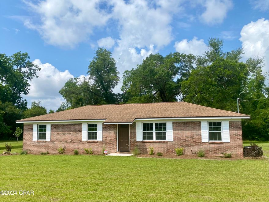 Major Price Reduction!!  Welcome Home!  This spacious 3 bedroom, 1.5 bath brick home is move in ready!  Step in the front door to the living room that is open to the kitchen and dining area.  From the kitchen window, you can watch your kids or pets play in the backyard.  The cozy, new family room opens to the backyard.   Many new upgrades include flooring, paint, light fixtures, plugs & light switches, toilets, etc.  New HVAC in 2020.  New roof in 2018.  Security System.  This is a one owner home and has been well maintained!  The location feels like you're in the country, but it's just outside Marianna close to amenities such as shopping, parks, schools & Chipola College.  Come enjoy our quiet country lifestyle.  Call your favorite Realtor today to see this home!