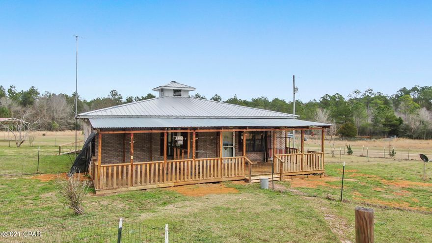 CURRENTLY UNDER CONTRACT, SELLER ACCEPTING BACKUP OFFERS. 

Beautiful farm property close to I-10! This property is perfect for someone that enjoys country living.  Bring your horse, cows, pigs, chickens, or whatever farm animals you have! The land is crossed fenced. Plenty of room to plant a large garden even. Spend the afternoons fishing in the pond on the property.  The home is solid! Block filled with concrete & bricked over. The living area is open to the large kitchen. 2 Murphy beds in the guest bedroom. The property features a huge workshop, 2 RV carports, and a mobile home with its own power/septic. Infinite possibilities with this property! It will not disappoint. All measurements are approximate, verify if important.