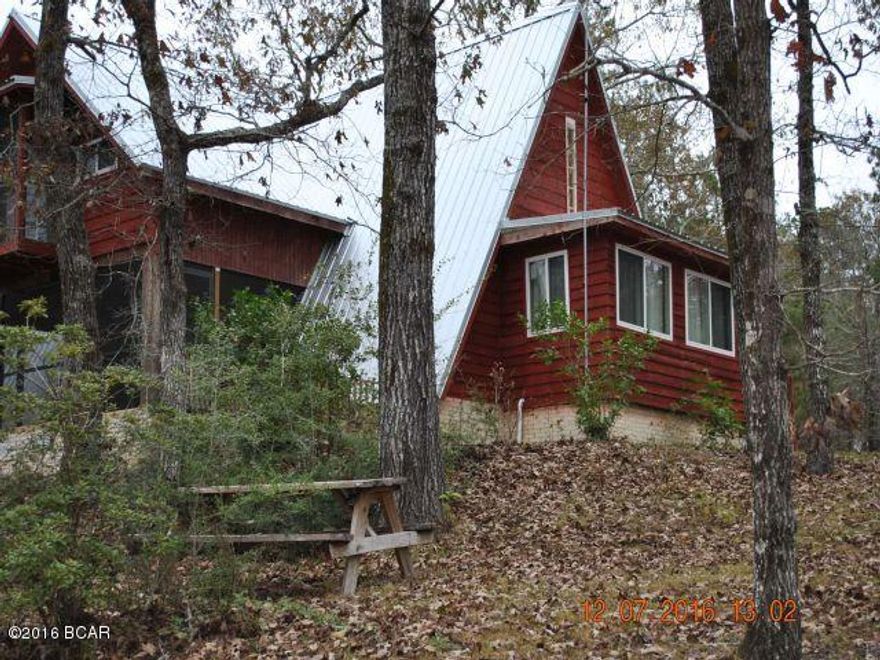 Want a quiet place in the Country??? This is it!!!! Recently remodeled A-Frame on 20 acres with a view from the porch that makes you think you are in the mountains! Plenty of deer, turkey, and other wildlife right out your door on this wooded 20 acres. New Septic system also!!! Use as your primary home or that weekend getaway! New Septic System 2015, New Metal Roof 03/2016, New Water Heater, New double-pane windows throughout, New Exterior Doors with built-in blinds, New submersible well pump & controls, new ramp entrance to front porch, front porch and balcony recently screened. New washer & dryer, New side-by-side fridge, new upright freezer all included in sales price!!!  Don't miss out on this one!!!