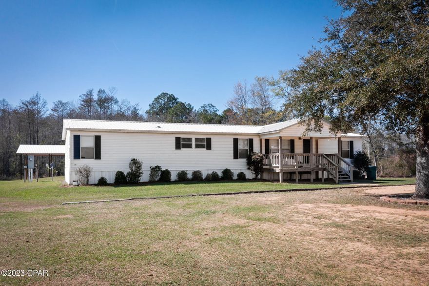 ''CURRENTLY UNDER CONTRACT, SELLER WILL CONSIDER BACKUP OFFERS'' SELLERS MOTIVATED!!!!  Country Living at its best!! This 4 bed/ 2 bath DWMH is Move-In Ready!  Open concept and split floor plan. Spacious Living Room open to the Dining Area. Separate large Family Room, complete with fireplace, open to the Kitchen that features lots of cabinets and eat-in bar.  Master bedroom has oversized connecting room that could serve as office/nursery.  Master bath features double vanity.  Outside features include backyard partially chain link fenced-in, pole barn, workshop with electricity and water and storage building.  All of this and so much more sitting on 2.5 acres with no restrictions.  Don't miss out, call today to schedule your personal viewing!