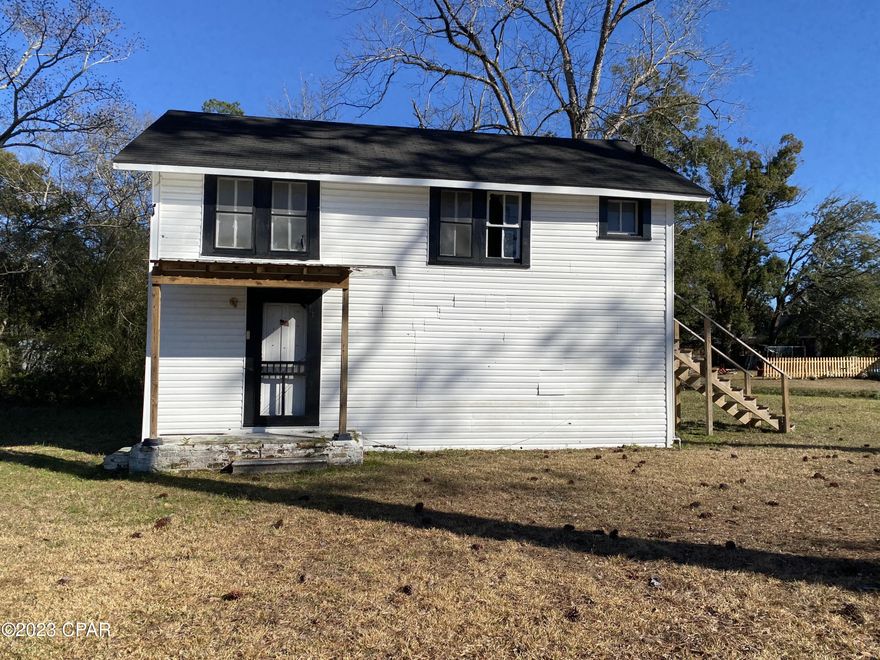 HANDYMAN SPECIAL AT A GREAT LOCATION! This is a city lot conveniently located in downtown Chipley, just minutes away from dining, shopping, entertainment, schools, and hospitals. This building has stairs on the exterior leading to the upstairs unit. One bathroom/bedroom downstairs and one bathroom/bedroom upstairs. The building needs work and would make a charming home or rental once finished. Alternatively, the buyer could remove it and rebuild. Let your creativity go wild with this one! The options are endless! The opportunity for the land alone at this location is awesome and the building is a bonus!