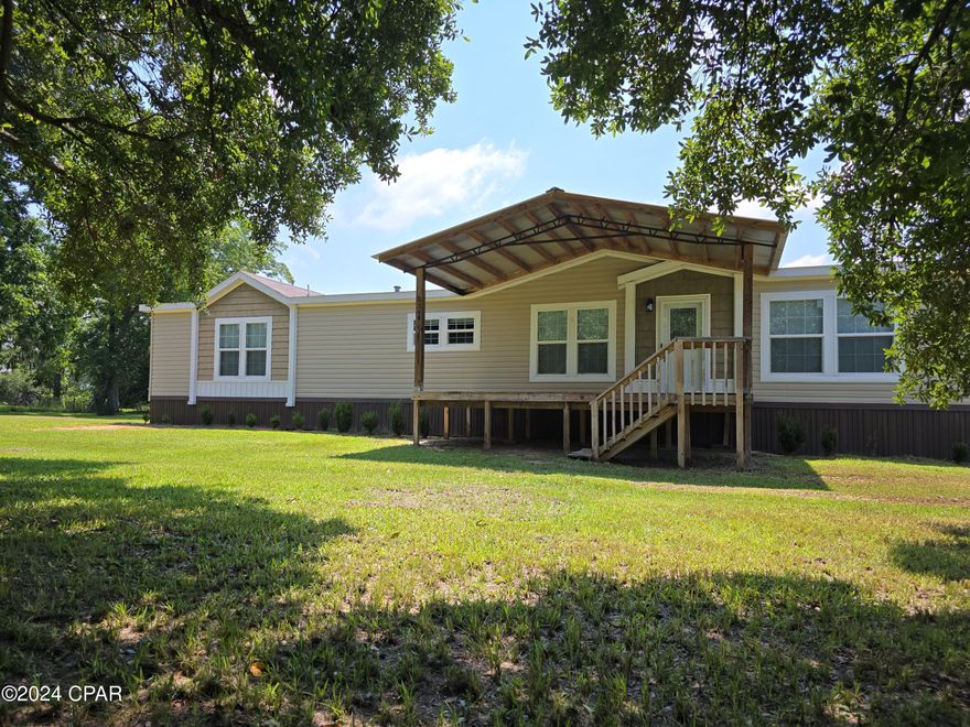 Priced to Move! 3 Bedroom 2 Bath Home with office on an acre! This gorgeous home featuring a split floorplan design offers over 2100 sq.ft. of living space. The living room, kitchen, and dining area feature a somewhat open and flowing concept. The kitchen boasts a large center island, new appliances, and a large pantry for storage. The living room features a modern electric corner fireplace, and and ample natural lighting from the oversized windows. 

Moving on, the Master Suite offers a large double vanity, water closet, oversized soaker tub, walk-in shower, and a large walk-in closet. On the opposite end of the home you will find the remaining two spacious bedrooms and office, as well as a very large laundry room that features its own sink and folding area, as well as additional space for a stand-up or deep freezer. 

Outside the property showcases an absolutely massive and gorgeous Live Oak tree that provides an abundance of shade in the front yard. The back yard is fully fenced with privacy fending, giving ample and secure space of children and pets to play. 

This property is located approximately 1 hour from Panama City Beach, and Less than 1 hour to Dothan, AL, giving you access to the conveniences of a larger town, but the peaceful tranquility of small town living. This property has so much to offer. Schedule your showing on this one today!