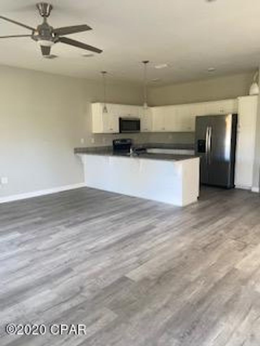 Beautiful town home,located close to beaches! Kitchen has white cabinets, granite counter tops and stainless appliances.Gray plank laminate flooring all throughout the downstairs living area w/ carpet throughout upstairs bedrooms. Laundry is also upstairs for added convenience. 3 bedroom 2.5 bath. large closets, Master with walk-in and double sinks in master bath, 1 car garage,close to Beach,shopping,restaurants and Navel Base