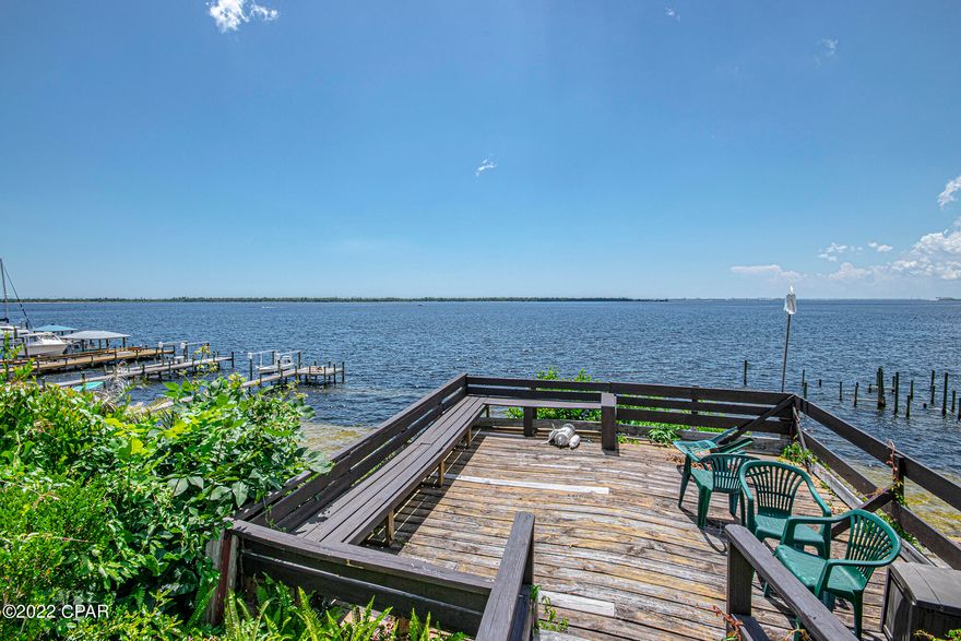 GO SHOW! TAKING BACKUP OFFERS! 

Such a lovely view! Sit and drink your coffee in the sunroom overlooking the bay. This waterfront home sits on almost a half an acre, one of the highest elevations in the Cove and it has access to the gulf. The first floor has 2 bedrooms and 1.5 baths. Upstairs you will find a large space with closets and plenty of storage, a full bathroom and a separate A/C unit. The garage has stairs that lead to the attic.  There is a cottage in the front of the home. You could use it as a mother-in-law suite or rent for added income. It's a 1 bedroom 1 bath with a kitchenette. Was built in 2020. 

All electric, a/c, roof & water heater less than 10 years old.

Home is occupied & on supra so please make an appointment.