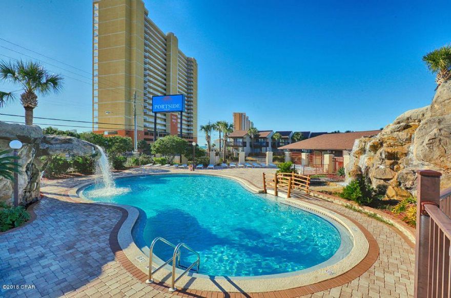 WoW! This very nice 2 bedroom/2 bath Portside unit is a rarity with 2 baths, and is ideally located in the center of the complex. Very close to the middle pool and backs up to a natural setting so this location affords you privacy, and is close to all the amenities Portside has to offer. Portside features a tropical pool area up front with thatch shade huts, waterfall, hot tub and three pools and fitness center. The complex also has three tennis courts and shuffle board for your enjoyment. This tastefully decorated non-rental unit is used as a vacation home, and is in great condition. Call to see is this gem today, as it won't last long!