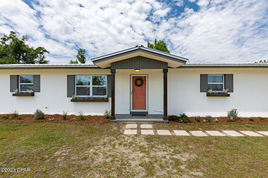 Currently under contract taking back up offers. Come see this beautifully remodeled home! Home was taken down to the studs and completely rehabbed. Roof, HVAC, and hot water heater less than 5 years old. New windows throughout. New kitchen with an 8' x 4' granite bar. New cabinets with granite countertops, new stainless steel LG appliances, stainless steel farmhouse sink, even a pot filler! Both bathrooms have new cabinets and master bath has a tile walk-in shower. Master bedroom boasts a huge walk-in closet with mini chandelier. Home has new LVP flooring throughout, interior doors, and new interior and exterior paint. There is a concrete pad ready for a detached garage or workshop. Lot is .5 acre and is fenced. Most of the interior plumbing and wiring is also new. this home is on well and septic with a water softener that is owned by the seller and will stay with the property but the public water and sewer tap is right next to the property and can be accessed.All measurements are approximate and should be measured if important.