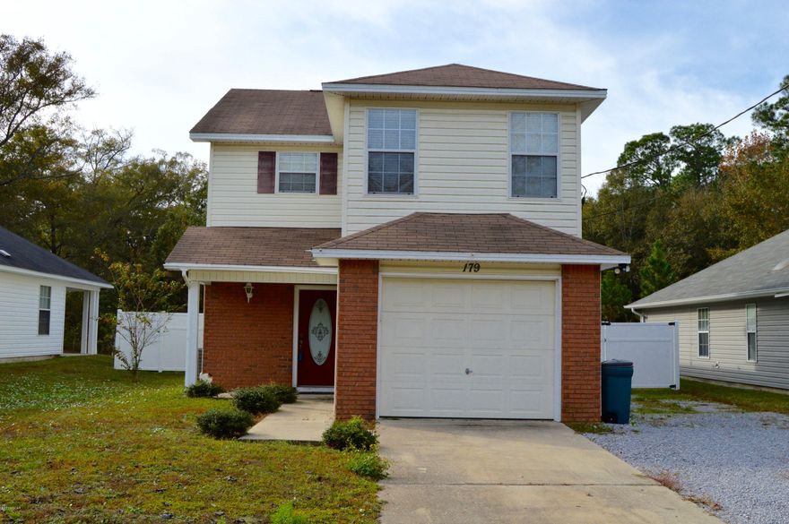 Cute 2 story home with a lot to offer! This home features stamped concrete flooring, stainless appliances, wood flooring in all 3 bedrooms and tile in the  bathrooms and kitchen. Walking in the door, you'll find an open floor plan with the living, dining and kitchen area. With those rooms the main floor also includes a 1/2 bath and laundry  room. Travel upstairs to find two roomy bedrooms with plenty of closet space and full bath to share. You'll also find a spacious master bedroom with a tray ceiling, a walk in closet and it's own full bath! The backyard features a covered porch,fire pit, workshop with electric, all surrounded by vinyl fencing for privacy! Parking includes a single car garage, drive way space and additional drive on the north side of the home for extra parking.
