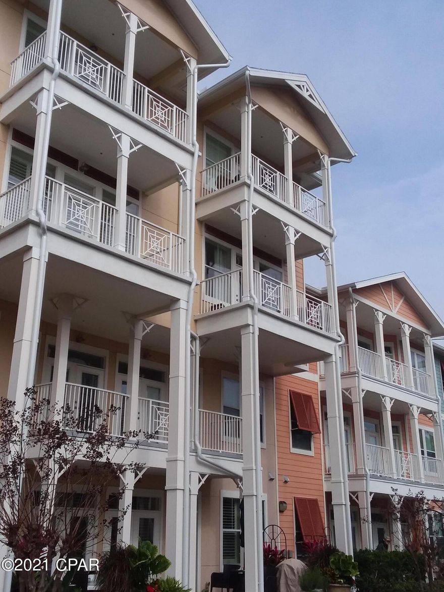 BEAUTIFUL VIEW - TOP floor 1-bed unit with 2 stories in the desirable Building #5!  Two Balconies -  one off the Living room and one off the Master bedroom overlook the lovely courtyard, water fountains and swimming pool. The Living and Dining areas have 10' ceilings, crown molding and updated laminate flooring. Kitchen has ceramic tile flooring, stainless steel appliances, granite counters and a pantry. A half bath, walk-in closet and storage room are also on this level. The second floor Bedroom has 10' ceilings with private balcony, walk-in closets with custom storage features, and a large En suite double vanity bathroom with a walk-in shower and soaker tub. This floor features another storage room and laundry. Water heater, lines and valves replaced 9/2020.  New upstairs A/C unit installed in 3/2020. Park your car on the same level garage and walk to your unit, no need to use the elevators.  Island Reserve offers great amenities such as a gorgeous 1-acre lagoon style pool with waterfalls, interactive splash pad and hot tub. There is also an indoor basketball court, fitness center, game room and theater room. All measurements are approximate, please verify if important.