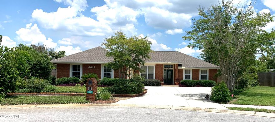 Beautiful well cared for all brick home with a 3 car garage,  in-ground re-surfaced gunite pool, new roof and windows, lush landscaping including fruit trees and bushes. This inviting home offers split bedrooms that make this floor plan ideal. Upon your entrance you will be drawn to the high ceiling and abundance of natural light.  There is a fireplace in one of the two living areas and separate formal dining or flex space. 

The kitchen is open and updated with an eat in area looking out to the scenic garden.  There is even a heated and cooled sun room. The neighborhood is centrally located with sidewalks, under ground utilities and this home is located at end of a cul-de-sac. 2nd bath is sized for accessibility; 3rd bay in garage is set up for a shop with wall that can be removed.