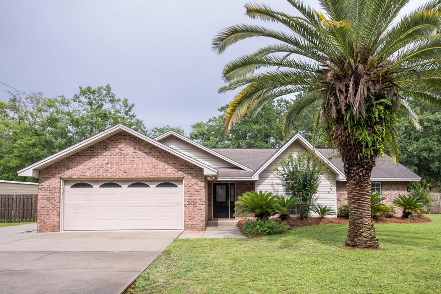 BRAND NEW ROOF with 30 year dimensional shingles!! This lovely 3 bedroom, 2 bath brick home in Lynn Haven awaits you! Brand-new carpet and freshly painted this home is move in ready!! Home features painted cabinets with granite countertops in the kitchen/dining area. Nice vaulted ceiling in the living room giving you a larger feel when you walk through the foyer into the living room. Wood burning fireplace with mantle. Master bedroom features a bath with double vanities and a walk-in closet. The large screened in back porch makes it nice to sit outside certain times of the year!! Extra special feature on this house is the 12x20 detached garage/workshop, Large fenced backyard.
