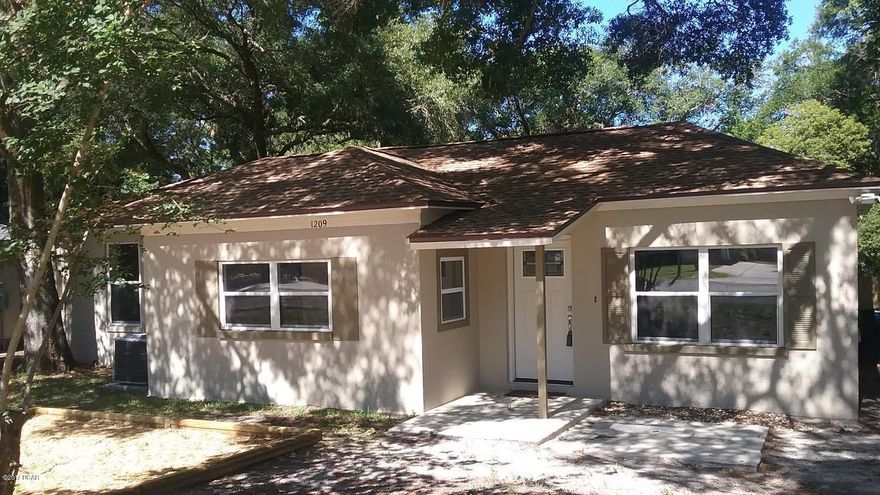 CHARMING COTTAGE on quiet tree shaded street in old DOWNTOWN ST ANDREWS. Enjoy a leisurely stroll to it's great restaurants, bars and shops. This MOVE-IN READY home features spacious living and dining areas. The UPDATED KITCHEN features new STAINLESS APPLIANCES, new Counter Tops and a beautiful tile back splash!A bonus SUN ROOM would make a great HOME OFFICE. The Master Bedroom opens to privacy fenced back yard and features a walk in closet. Stylish HAND SCRAPED flooring adds great style and function throughout. The CONCRETE BLOCK exterior, NEW ROOF, NEW HOT WATER HEATER AND NEW CENTRAL HEAT/ AIR  make this a worry free investment and allow for lower Insurance and Utility costs. Don't miss this hard to find ST ANDREWS BARGAIN!