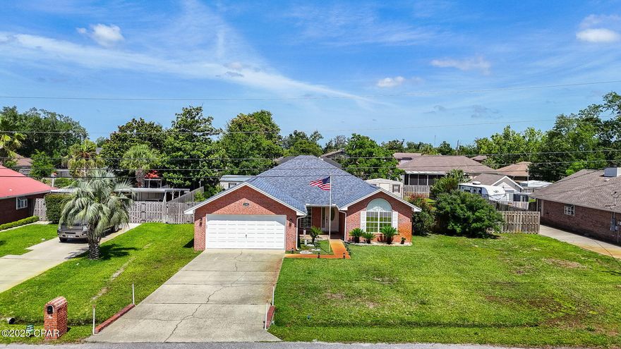 Centrally located in the heart of Lynn Haven, this 3-bedroom, 2-bathroom brick home features an open floor plan with 10' ceilings, luxury vinyl plank flooring throughout, crown molding, recessed lighting, and a desirable split-bedroom layout.

The newly remodeled eat-in kitchen offers granite countertops, a pantry, breakfast bar, and sleek black stainless steel appliances. A separate dining area provides the perfect space for gatherings. The spacious master suite includes a walk-in closet and an en-suite bath with double vanities and cultured marble countertops.

Step outside to a beautiful, large fenced-in backyard oasis, complete with lush landscaping, a screened-in back porch, an additional covered patio area, a sprinkler system with shallow well, and two storage sheds — including a 20x28 insulated shed with window A/C and a 10x16 utility shed.

This well-maintained home blends comfort, space, and functionality — a must-see!