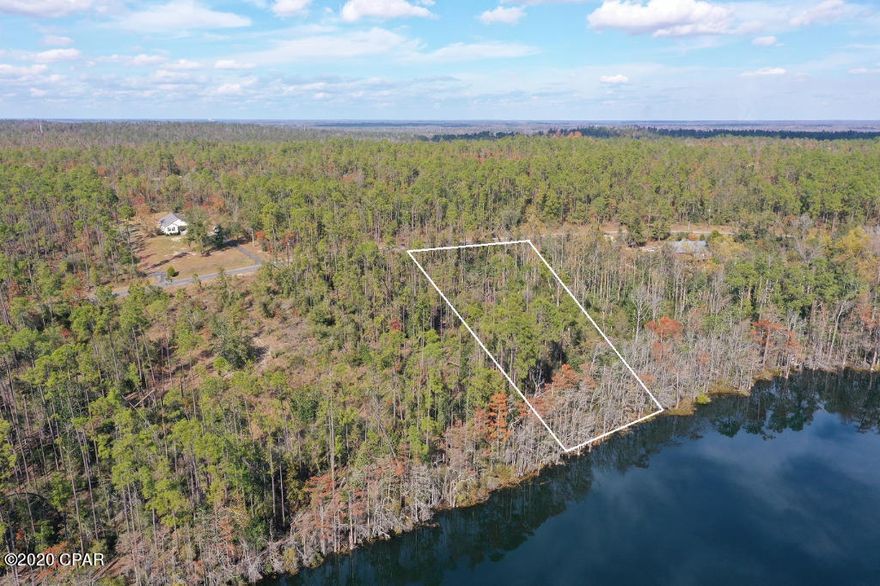 Rarely available 1 acre lakefront home site on McCormick Lake, a pristine 150 acre crystal clear lake located halfway between Dothan, AL and Panama City Beach.  The lake and surrounding community are private property for use by property owners only and the area is mostly undeveloped, providing a very private and quiet lake house setting.  The recreation area has a white sand beach, swimming area with dock, party pavilions, a clubhouse, and boat rentals.  Ownership on McCormick Lake also allows access to all of the facilities in Compass Lake in the Hills, which include the larger 600 acre compass lake, an equestrian center with riding trails and stables, tennis courts, disc golf, and a driving range.