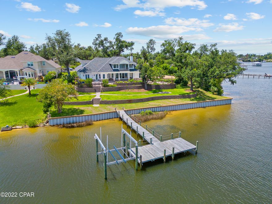 Fully renovated, modern coastal waterfront home in the Cove. Renovations include white oak wood floors throughout main floor and master suite and new light fixtures throughout. All baths have new tile, cabinetry, tubs and fixtures. Kitchen is all new including custom cabinetry, two kitchen islands, waterfall quartz countertops, new appliances with 6-burner gas range, Miele coffee station and walk-in pantry. Mud room/laundry room features quartz countertops, wine cooler and custom cabinetry with additional refrigerator and sink. Home has new paint throughout interior and exterior. The home offers 4 full bedrooms, 3 full baths and 2 half baths with a very large bonus room and wet bar upstairs. New sea wall was installed and home features a pool and spa. Entered for comp purposes only.
