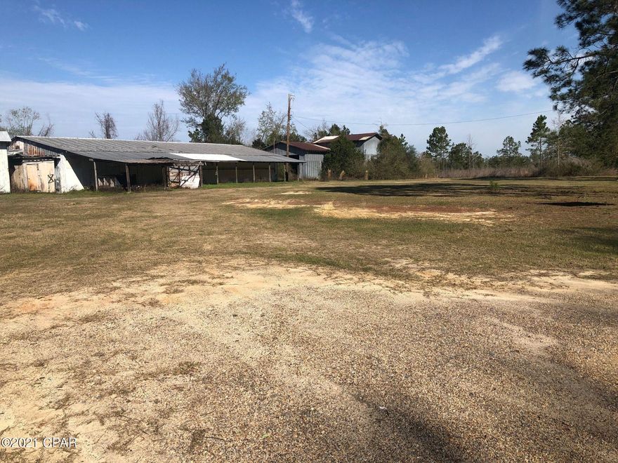 1.5 ACRES WITH 300 FEET FRONTAGE ON STATE ROAD 79, THE GATEWAY TO THE BEACHES.  THIS PROPERTY HAS 3 OLD BUILDINGS ON IT, ONE OF THE BUILDINGS IS ON AN APPROXIMATELY 4800 SQ FT SLAB --- NEEDS REPAIRS TO ROOF AS THERE IS SOME METAL ROOFING THAT NEEDS ATTENTION.  THIS PROPERTY IS LOCATED ONLY 2.5 MILES FROM BONIFAY.  A GREAT INVESTMENT!!!!