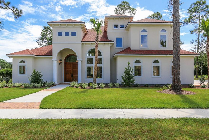 LOOKING FOR A EUROPEAN QUALITY HOME IN PANAMA CITY? Then, you need not look any further! Centrally located in The Woods subdivision, this incredibly built Mediterranean style home exudes quality. From the professionally landscaped yard to the solid, double Red Mahogany front doors, you know before you enter, this dwelling has high-end features not often found in American homes. 2x6 construction, steel rods installed at 6' intervals and 50 yr shingles, this home will easily withstand 140 mph winds! The high end Anderson windows ensure heat from the outside is reflected, at the same time preventing the escape of cooled air from within.  Stepping into the foyer, you will be impressed with the beautiful hardwood flooring and the 22 ft ceilings that extend into the Great Room. The focal point of the Great Room is the magnificent 2-story mirrored gas fireplace with a granite hearth. A wet bar in the GR helps to keep guests out of the kitchen! Dine with your family and friends in the stunning Formal Dining area that features chair rail and a 15ft ceiling!  There are solid core 8 ft doors, custom cabinetry and exotic granite countertops throughout the home. The patio also has a 22 ft ceiling and an outdoor kitchen complete with gas grill, exhaust fan, sink and weather-proof cabinets! If you want to add a swimming pool to the backyard, all the lines are already there! The kit has a gas stove, refrig, pantry, breakfast bar and is open to the large family room and breakfast nook. Off the FR is an ensuite bedroom that makes a great guest room or office. Enter the MBR suite through dbl doors...truly a retreat with the adjoining MBA that has a huge, beautifully tiled, multi-headed shower, dbl vanity and garden tub!  Heading upstairs, there is a loft are overlooking the GR with a wet bar that includes a small refrigerator. From the loft you may step out to a large slate balcony to see the beautifully landscaped backyard. Two of the three bedrooms upstairs share a jack and jill bathroom and all have walk-in closets. The 3rd bedroom is ensuite. There is so much more, you really must see to appreciate! Please see the attached document that goes into great detail on all the wonderful upgrades this home has to offer. All sizes, sq ft, age, rm sizes are estimates. Please measure if concerned.