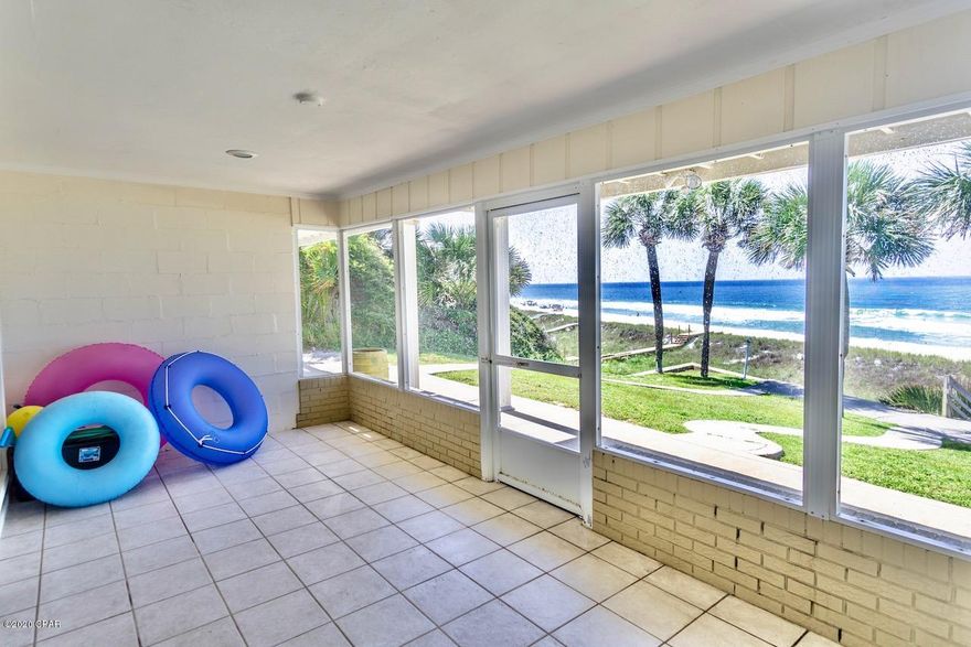 'CURRENTLY UNDER CONTRACT, SELLER ACCEPTING BACKUP OFFERSStep right out your door to the gorgeous white sand and emerald waters of the beach! Imagine owning luxurious Panama City Beach oceanfront with your own lawn, sidewalks, palms, and seawall! This unit is light, bright, and beautifully decorated with designer cabinets.  Watch the gorgeous Gulf of Mexico sunsets from kitchen/ living area and master suite upstairs! It is sold furnished except for some personal items. This three townhome complex has a seawall .  No association fees as you own your lot. The three non-rental units share the cost of common areas.  It is across from one of the local's favorite cafes, Sunnyside Grill!. Walking distance to ice cream shop and Carousel gourmet grocery store, West end of the beach is normally less busy. Please verify all information and measurements.
