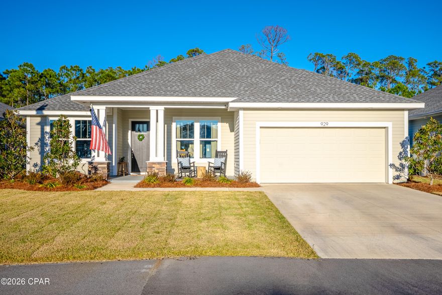 Welcome to the pinnacle of luxury coastal living in Breakfast Point East. This exceptional Tripletail II with the Coastal Cottage elevation offers approximately 3,101 square feet of thoughtfully designed living space, featuring four bedrooms, three and a half baths, and a spacious bonus room that can easily function as a fifth bedroom or flexible living space to suit your needs.
Built with safety, durability, and efficiency in mind, this home is one of the rare properties in Breakfast Point constructed with 2'' x 6'' steel framing, a hurricane tie-down rod and anchor system exceeding Category 5 wind resistance, and spray-foam insulation for superior comfort and energy efficiency. Situated on a premium lot backing to serene conservation, the home offers privacy and tranquil views. The expansive backyard is pool-ready, with electrical already in place, providing the perfect opportunity to create your own private tropical retreat. Due to superior construction this house has low insurance costs under $1500 for present owners and power bills are low too! Inside, the home showcases 9- and 10-foot ceilings, large-format tile in the bathrooms, and luxury vinyl plank flooring throughout the main living areas. The kitchen and living spaces feature a cohesive, upgraded finish package with a light, coastal-inspired aesthetic. The kitchen is anchored by full-height shaker-style cabinetry in a soft off-white finish, accented with brushed nickel hardware and crown molding extending to the ceiling. Quartz countertops with subtle gray veining provide a refined and durable surface, including the oversized center island that offers generous prep space and casual seating. A vertically stacked elongated tile backsplash with a gloss finish extends behind the range and stainless vent hood, creating a striking focal point. The appliance package includes a counter-depth refrigerator, built-in microwave, stainless gas range, undermount sink, and a high-arc pull-down faucet, completing the space with both function and style.
Wide-plank flooring in a light natural wood tone flows seamlessly through the kitchen and main living areas, enhancing the open and airy feel. Recessed LED lighting and decorative clear-glass pendant fixtures provide balanced task and ambient lighting, while neutral wall tones, taller baseboards, and craftsman-style trim reinforce the home's timeless appeal.
The entry and staircase further reflect the home's upgraded character, featuring natural wood stair treads, white painted risers, and a stained handrail that complement the flooring. Square newel posts and painted balusters create a refined transition between levels, while the elevated foyer ceilings enhance the sense of space. The open-concept layout allows for effortless flow between the kitchen, dining, and living areas, resulting in a cohesive, move-in-ready home with strong market appeal and high-end coastal charm.