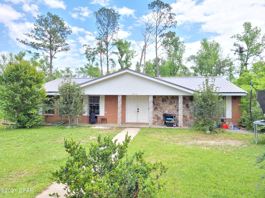 Are you looking for a home for your Large Family? Well Stop and look no further. Located in the City limits of Marianna and is close to shopping and Chipola College! Brick home with 5 Bedrooms 1.5 Baths with 2378 sq ft. sitting on a half acre at the end of a dead end street!  New metal roof. Ground floor has Living Room, Kitchen/Dining Area, 3 Bedrooms 1.5 baths. The Finished Basement has 2 Bedrooms, Office, Laundry Room and 2 Car Garage. Updated Kitchen with breakfast bar. Plenty of room in the yard for the kids to play! Home needs some TLC, but can be made into the perfect home for your Family!! Priced for a quick sale! Call for additional information or your personal showing!!