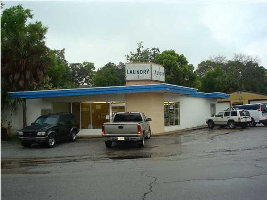 List price includes removal of existing building. Severe hurricane damage. Buyer would need to verify viability of re-build if desired.