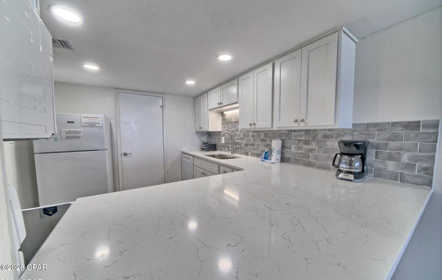 Sunny & Relaxing 5th Floor Condo in Mid-Rise B3 @ Pinnacle Port. Located only 3 miles from Rosemary Beach and all that 30A has to offer. **RENOVATED Kitchen with New Appliances, New LVP Flooring, and New Bathroom Vanity, and Beautiful Walk-In Tiled Shower. Unit is Fully furnished with NEW LIVING ROOM FURNITURE COMING FEBRUARY and offers a relaxing coastal lifestyle with easy access to the beach. This building has new ELEVATORS. The Community has many amenities including access to Boat Slips and Launch, Kayak/Paddle Board rentals, Bocci Court, Playground, Shuffleboard, a Gym, and two Pools with a large Heated Pool. Unit is open and inviting with plenty of seating. Enjoy the stunning views from the balcony overlooking the coastline. This property is uniquely located between the Beach and Lake Powell and next door to Camp Helen State Park.