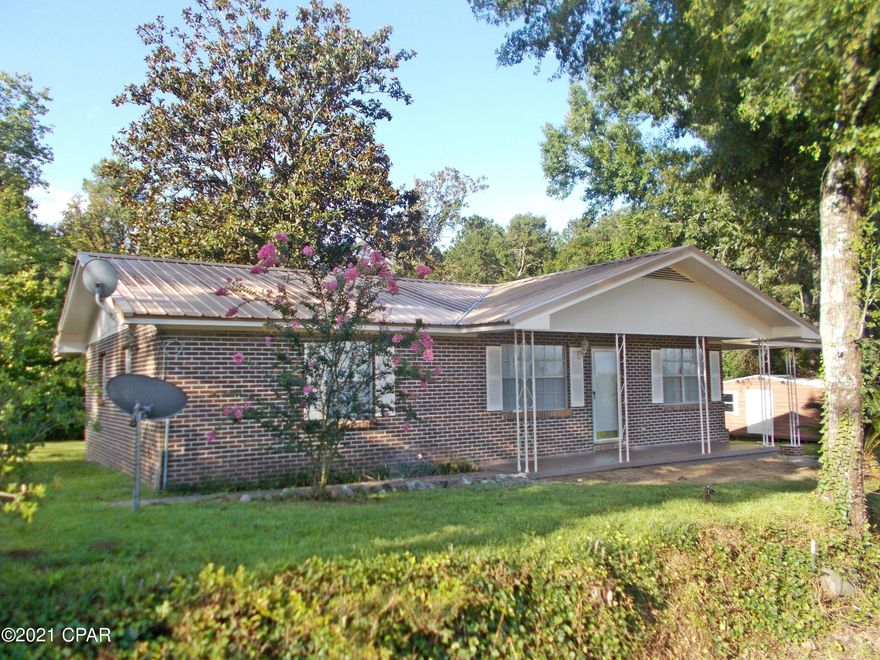 This home was updated 3 years ago including a new AC unit, and used as  a rental there has been additional work on it to list it. new paint, new laminate floors in bedrooms new ceiling fans new blinds, some new  interior doors new paint outside, new ceiling fans, it is on a quiet country road not far from Graceville or Dothan, nice large shed in back, level lot, it also has a metal roof, call to view it today it is vacant and easy to show.