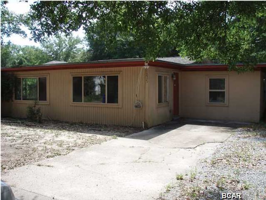 Cinder block home conveniently located in St Andrews. Super large living area just inside the front door has terrazzo floors & opens to the dining area. This 3 bedroom 2 bath home has an open floorplan with a screened back patio and privacy fenced backyard. Home needs work likely to include roof work, ceiling repair, appliances, flooring, paint, exterior wood repair and at least 1 window replacement. ThereEmployees and family members residing with employees of JPMorgan Chase Bank, N.A., it's affiliates or subsidiaries are strictly prohibited from directly or indirectly purchasing any property owned by JPMorgan Chase Bank, N.A. Home was built before 1978 and there is a possibility of lead based paint.