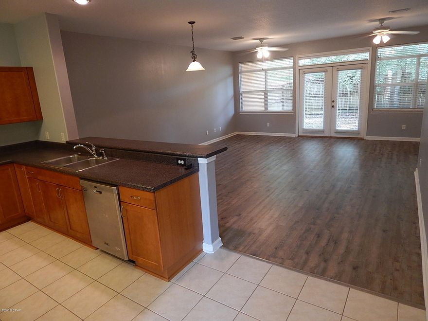 Newly updated, Townhome conveniently located in town with garage, privacy fenced back yard, and NO HOA DUES. This home is nicely laid out with a large open Living area, lots of light, and new flooring. Spacious kitchen with lots of counter space and all appliances stay. Downstairs 1/2 bath convenient to guests. Incredible Master suite with large walk in closet and bath. Complete with large oval soaking tub, double vanities, and separate shower. Other bedrooms are spacious and down the hall from the master for privacy. This home has newer  metal roof and AC. So enjoy all the space without the yard work. Lots of storage in the garage.