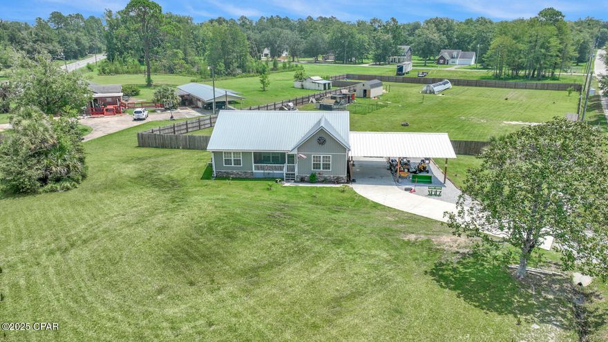 Welcome to peaceful country living, just minutes from the conveniences of downtown Chipley! This charming 2021 built, one story home sits on a generous 2.36-acre lot, offering the perfect blend of privacy, space, and small-town charm. Truly one of a kind, there's nothing else like it currently on the market.

No HOA and plenty of room to live the lifestyle you love. Bring your chickens, the adorable chicken coop stays with the property! A large covered carport provides ample space for your RV, boat, or extra vehicles, making this a dream setup for hobbyists, travelers, or outdoor enthusiasts.

The entire property is secured with a full privacy fence, giving you peace of mind and your own quiet oasis. Enjoy relaxing on the screened front porch or step out back to the expansive deck, ideal for grilling, gathering, or simply soaking in the serene views of nature.

Inside, you'll find a meticulously maintained split floor plan. The spacious master bedroom features a walk-in closet and a luxurious Jacuzzi tub, creating a perfect retreat at the end of the day.

From the outdoor space to the thoughtful interior layout, this property offers endless potential to create your own countryside paradise, while still being only 2 minutes from local restaurants and shops.

Homes like this don't come around often. Schedule your private showing today!
(All measurements are approximate and should be verified if important.)