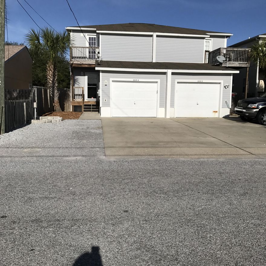 Beautiful Townhome on Beach Drive.  See the Gulf from your upstairs deck.  Walk across the street and swim in the gulf.  Great location.  Convenient to shopping, bike rides on Thomas Drive, and great restaurants.  No HOA fees.  All furniture stays including washer and dryer.  Brand new hot tub and deck in back yard is also included in sale.  Hot water heater is brand new.  New lift station put in 2 years ago. New Carpet will be installed on Monday Jan 30, 2017.  New carpet on stairs and entire upstairs.

This home will not last long!! It is a must see at popular Bitlmore Beach.