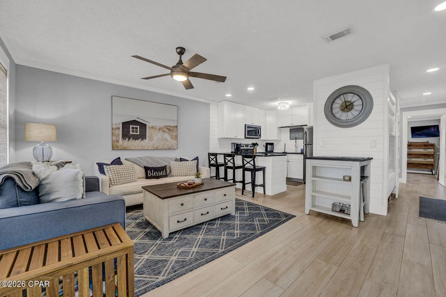 Discover this hidden gem at Peachtree Place I Condominiums in Panama City Beach! This beautifully updated 1-bedroom, 1-bath condo with hall bunks is located just steps from the sugar-white sands, approximately 100 steps to beach access, offering incredible value for this proximity to the Gulf.  Ideally situated less than 3 miles from Pier Park and about 1 mile from Thomas Donut & Snack Shop, this condo places shopping, dining, and entertainment close by. Fully renovated in 2023, updates include new tile flooring throughout, an updated bathroom, new interior doors, upgraded trim and molding, new hardware, custom laundry doors, refreshed bunk area with added lighting, and new fixtures. Additional improvements include a new HVAC in 2024, new hot water heater in 2025, and a custom closet system in the primary bedroom. The living area features a West Elm sleeper sofa for added guest space.  Move-in and rental ready, this well-maintained condo offers an unbeatable location, modern upgrades, and excellent value, perfect as a vacation retreat, investment property, or personal getaway.