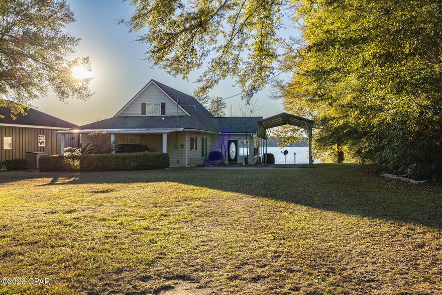 Beautiful lakefront single-family home on a full acre at the end of Seminole Lane, overlooking the pristine, spring-fed waters of Silver Lake. This 3-bed, 2-bath residence offers open living spaces, a covered porch with water views, and an entire second-story master suite for added privacy. Property features include a 2-car (20'×24') carport with an attached 20'×12' metal storage building with utilities, plus a tall 25'×12' aluminum RV-ready carport with full hook-up. Enjoy direct access to the lake from your private 82-ft dock with platform and bench, perfect for fishing, swimming, or quiet mornings on the water. Ideal as a primary residence, weekend retreat, or investment opportunity (buyer to verify rental use).