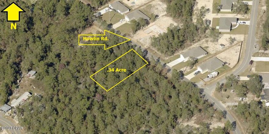 Nice wooded lot on quiet street with many new homes. Paved street. Power is at the curb and available. Very convenient to shopping in DeFuniak Springs, yet all the tranquility of the country.