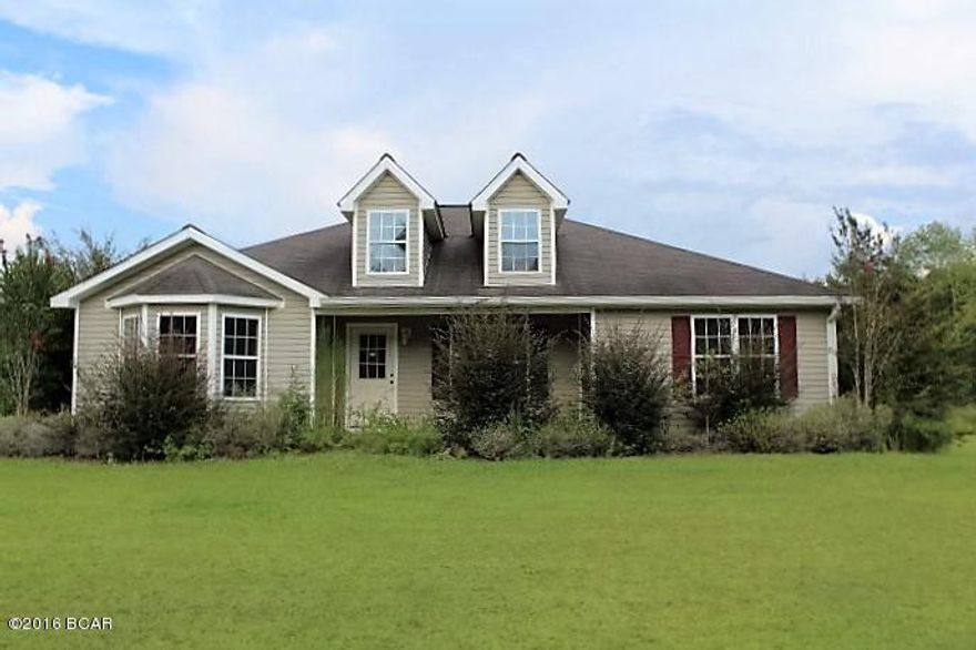 Beautifully designed newer home on 18.34 acres in the country.  The house has split bedroom design.  There is a large den off he kitchen (unheated) and there is a nice covered open back porch.  There is a large detached garage/workshop.  House needs some repairs but this is a great buy for country living on large acreage.