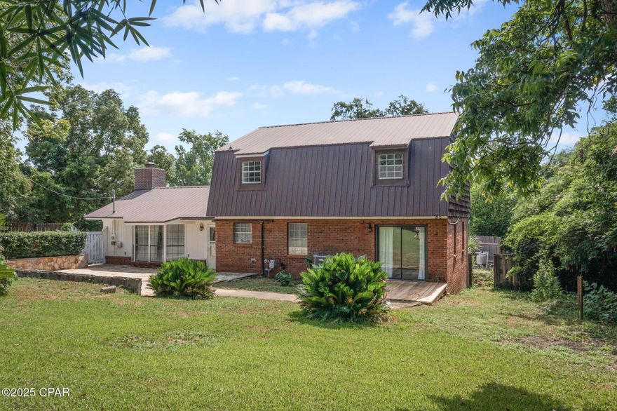 Step inside this Beautiful 3 Bedroom 2 1/2 bath POOL home that is located in Marianna City Limits! This home is located in the Historic district of Marianna and is close to all shopping, Restaurants, Jackson County Hospital and Chipola College! Marianna Main street has plenty to offer the family yar round to entertain your family and is right around the corner!! This home has so much to offer your family! The inground pool (with a new pool liner) is fenced for privacy and is perfect for you to relax in on these hot summer days with the kids! The Large Living room is perfect for entertaining your guests with a beautiful wood burning fireplace to cuddle up next to in the winter!! The kitchen has been updated including appliances, soft close cabinets, Farmhouse sink, center island and quartz countertops. Perfect for entertaining your guests! The Formal Dining room overlooks the backyard. There is an office on the first floor that can be easily converted to a 4th bedroom. There is a large separate laundry room with plenty of storage & a half bath on the first floor which is close to the pool area for minimal wet floors!
The master bedroom with en suite, 2 additional bedrooms and a full bath are on the 2nd floor. The backyard has a 2 story workshop with a door to the storage area and a separate door on the 2nd floor which can be converted to another office area, playroom for the kids or a room for your guests. The stone patio area is perfect to watch the kids play in the yard! So what are you waiting for?? Call today to see this beauty!!