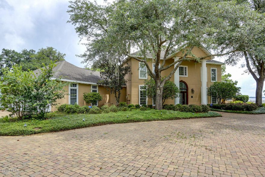 ONE OF A KIND PREMIER PROPERTY WITH 280 FT ON NORTH BAY! THIS HOME IS SITUATED ON A PENINSULA IN THE PANAMA COUNTRY CLUB AND OFFERS SPECTACULAR VIEWS OF NORTH BAY FROM ALMOST EVERY ROOM. INTERIOR FEATURES INCLUDE 4 LARGE BEDROOMS AND 3 1/2 BATHS, GRAND FOYER WITH A CHANDELIER FROM THE RITZ CARLTON!, MARBLE FLOORING, 20 FT CEILINGS, FORMAL DINING ROOM, STUDY WITH SOUND SYSTEM, BUILT IN WALL TO WALL SHELVING AND CABINETRY, LARGE LIVING ROOM WITH GAS LOG FIREPLACE, THE KITCHEN IS A COOKS DELIGHT THAT WAS COMPLETELY REFINISHED FOUR YEARS AGO WITH NEW CABINETS, GRANITE TOPS, TWO SIDED KITCHEN SINKS, TRASH COMPACTOR, GAS STOVE WALK IN PANTRY AND OPEN BREAKFAST AREA OVERLOOKING THE BAY, THE MASTER SUITE IS CONVENIENTLY LOCATED ON THE FIRST FLOOR AND IS COMPLETE WITH DOUBLE VANITY, LARGE HI AND HERS WALK IN CLOSETS, WHIRL POOL TUB, SEPARATE SHOWER AND FRENCH DOORS THAT LEAD YOU TO THE PATIO. UPSTAIRS FEATURES 3 LARGE BEDROOMS, DEN WITH LOTS OF STORAGE, BUILT IN DESKS AND 2 STAIRWELLS (front and rear). EXTERIOR FEATURES INCLUDE 280 FT OF WATERFRONT ON PENINSULA, BOAT LIFT, SEA WALL, THREE CAR GARAGE, HUGE PAVER DECK AND SPRINKLER SYSTEM. THE PANAMA COUNTRY CLUB HAS A 18 HOLE GOLF COURSE, CLUB HOUSE AND POOL. All information is estimated including age, square footage, and school zones. Click pic for additional photos, virtual tour, and homes website. Seller Disclosure and survey available in Documents