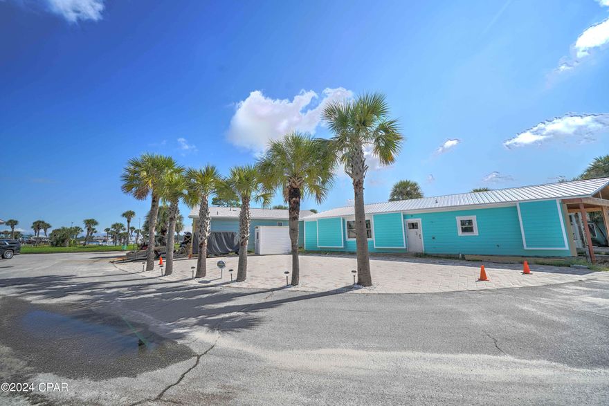 Great opportunity to own in beautiful Venture Out. This stunning corner lot is perfect for building your dream home or bring your RV! The location is amazing within the resort... close proximity to pool, boat launch, fishing pier and more! Venture Out is a golf cart community that has exploded with popularity recently... With 300' on the beautiful pristine beaches of the Gulf of Mexico and 1,000' on the Grand Lagoon. Venture Out has something for everyone. With 2 pools, fishing pier, boat ramp, mini golf, children's playground and much more!