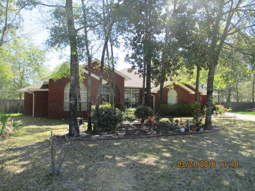 Gorgeous custom built home in one of the most sought after subdivisions in Lynn Haven and College Point. Welcome to Huntington Ridge! This well appointed home has over 2600 square feet, 4 bedrooms, 2 1/2 baths and is located on over a 1/2 acre of land. From the moment you walk in you will notice the contractor detail from the large crown molding to the barrel ceilings, raised trey ceilings and so much more. The great room features a double-sided fireplace, large window for natural light and it flows into the formal dining room. The kitchen features Quartz countertops, custom cabinets, island with deep drawers, breakfast bar, & large pantry. the oversized breakfast area is also known as the ''keeping room'' and has plenty of room for entertaining guests while in the kitchen. There is a cozy Florida room right off of the kitchen with glass windows and overlooks the beautiful backyard. The master bedroom features a bay window and trey ceiling. The master bath has a large walk-in closet, linen closet, jacuzzi tub, separate tile shower, water closet and double vanity. The other bedrooms all feature walk-in closets. One of the bedrooms is perfect for a large office/playroom and features a tile floor. The other bath is spacious with double vanity. Outside is one of the most incredible features. A large yard that is big enough for a pool and also plenty of room to roam. The current owner has a vegetable garden. There is a beautiful custom gazebo, fruit trees, and lovely natural landscape. The home features a 
3-car garage, sprinkler system for the entire yard, tankless hot water heater, direct electrical connection for a generator, annual termite bond and tons of storage throughout. Huntington Ridge is a fabulous subdivision with NO homeowner's association and NO FEES; however, the subdivision is very well maintained and does have covenants and restrictions.  This location is perfect for a military family and is just minutes to some of the best schools in Bay County. Make this home a MUST SEE on your list of possibilities today!