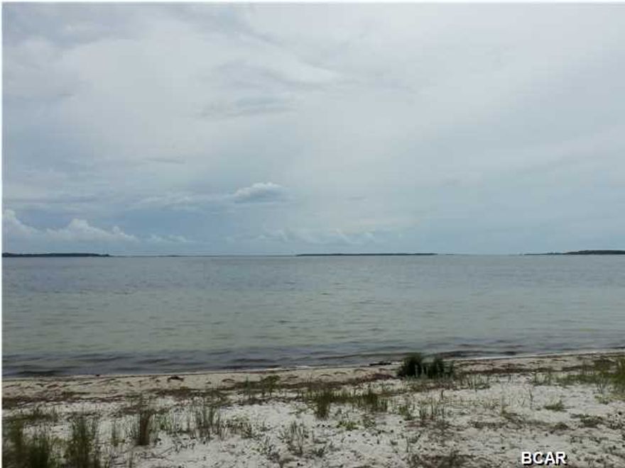 This beautiful home on HISTORIC W. Beach Drive has stunning views of St Andrew's Bay and an open floor plan for easy entertaining. Each room brings in the outdoor beauty whether it be the water or the professional landscaping or the magnificent oak trees that make St. Andrews such a desirable neighborhood. The living room focal point is the magnificent view of St Andrew Bay. Room has large windows for an unobstructed view of the bay and Beach Dr The kitchen is large and well laid out to also take advantage of the bay views. The kitchen features under cabinet lighting, large pantry, new tile floor, new granite with under mount sink and all new Kenmore stainless appliances. The den can be used as an office or cozy sitting room and Is situated off the side home entrance. The newly