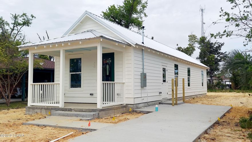 UNDER CONTRACT - TAKING BACK-UP OFFERS: Adorable Florida Cottage located in an established neighborhood in the heart of Panama City. You will see and feel the difference - Resilient construction with elevated slab, impact windows, metal roof and cement plank siding; Higher rated insulation installed for lower electric bills, HVAC ductwork (in conditioned attic) and landscape irrigation are on smart timers. The efficient layout, vaulted ceilings, accommodating bathrooms and ample closet space give the impression of a larger home. Large 50x143 lot for outside play. Close to schools, hospital and downtown shopping & restaurants. *NOTE: Interior pictures are what you can expect to be in this home, however, were taken of a previous new build with the same floorplan.